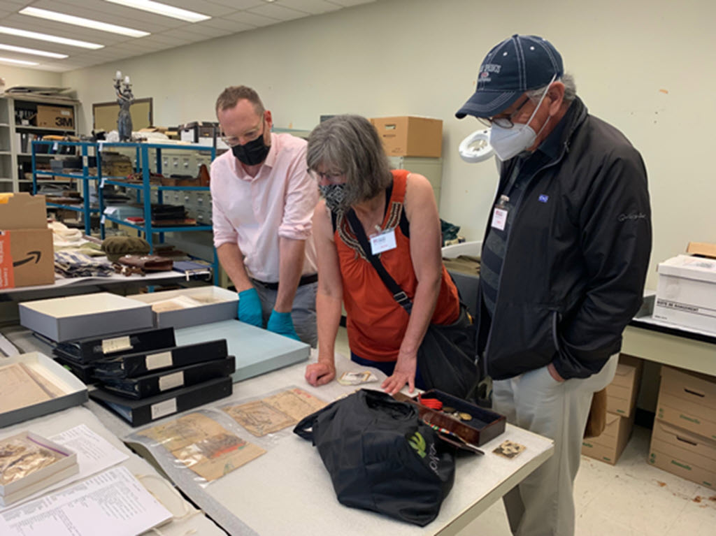 Roland Sawatzky, Pamela Poitras Heinrichs, Robert Alan 
				Ouellette view items at the Manitoba Museum