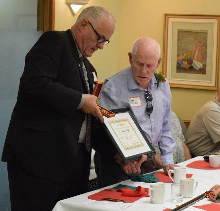 Ralph Maclean receiving the 
		Chinese Peace Medal from Art Hanger