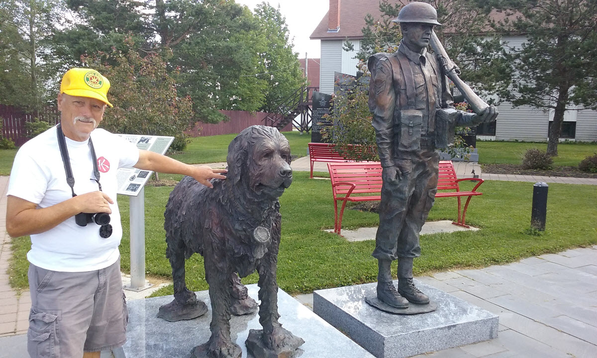 Standing with Gander's Statue in the Gander Heritage Memorial Park