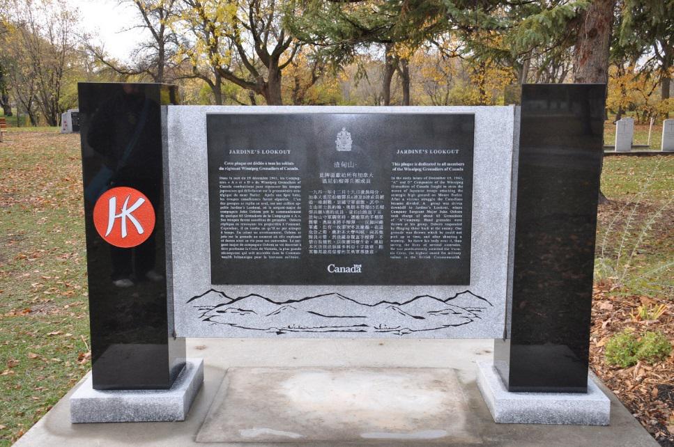 Looking West with the Jardine’s Lookout plaque and the Red shoulder patch with white HK on the pillar