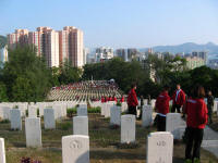 Honour guard of students ushering people into Sai Wan Cemetery. Click for larger image.