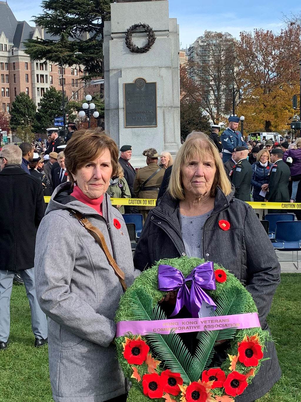 Gerry's daughters laying a wreath