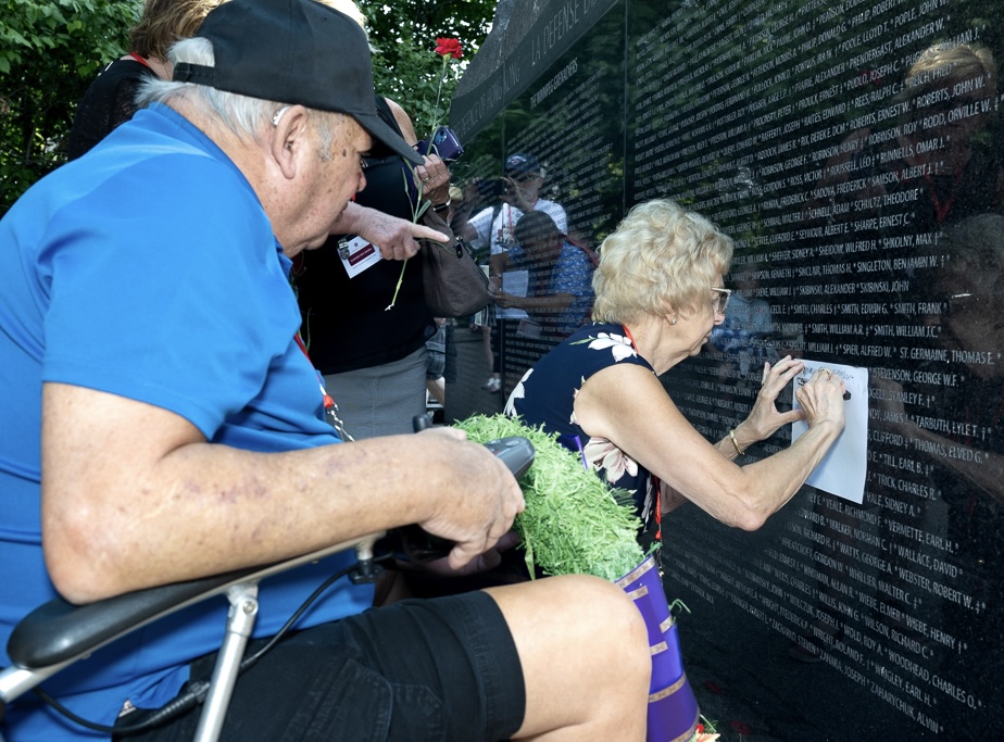 Ron and Pat Stodgell, gathering memories. They represented 3 Red River Metis HK vets - Ron’s father, George Roy Stodgell, and his 2 uncles, Garnet and Stanley Stodgell, who both died in Hong Kong. The mother of the three sons was the Silver Cross Mother in 1963. (Richard Lawrence photo). Click for larger view. Image of Ron and Pat Stodgell, gathering memories.